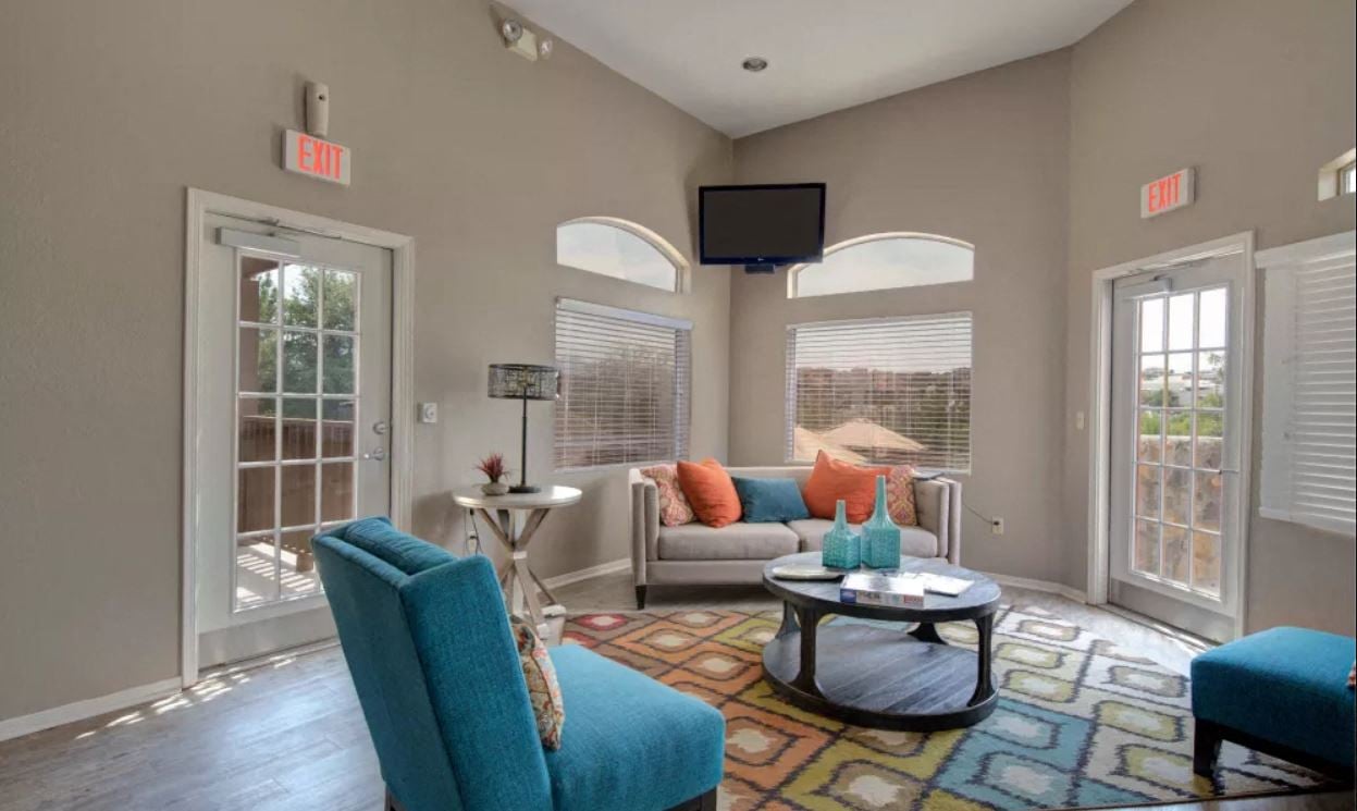 a living room with a couch and a tv